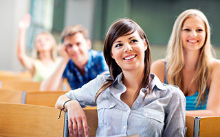 Smiling students in a classroom