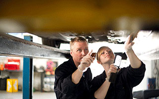 Automotive student working in garage