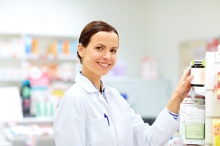 Pharmacy technician selecting medications from a shelf in a pharmacy