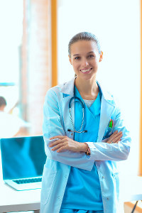 Confident ekg professional with stethoscope in hospital setting.
