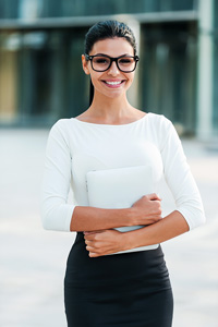 smiling business woman with dark hair and glasses