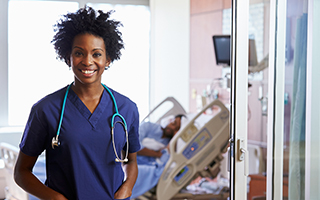 young African American woman with natural hair in scrubs with a stethoscope around her neck