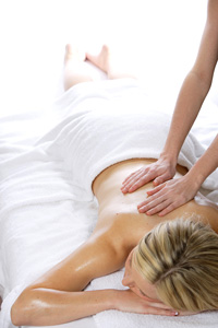 Woman receiving massage therapy.