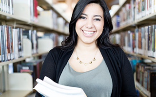 Student with books in the library