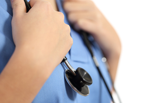 Close-up of a healthcare professional in blue scrubs using a stethoscope