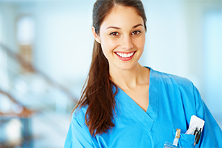 Friendly nursing student in blue scrubs
