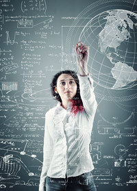 Woman in white shirt in front of blackboard.