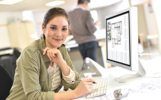 Graphic designer using computer in office setting