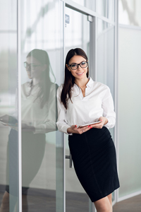 Woman standing in her office hallway